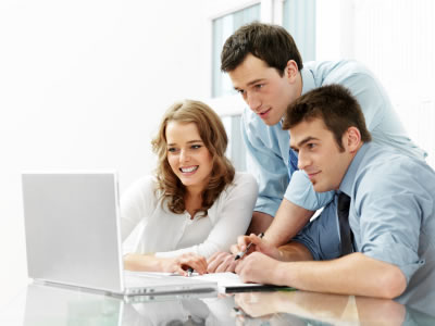 Man at PC designing web designs for businesses in Leeds & Bradford